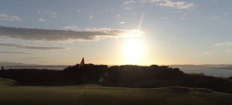 On the 10th green as sun goes down
